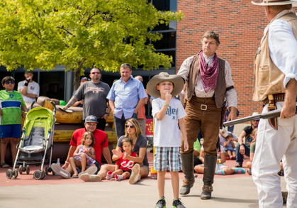 texas legends gunfighters with boy from audience