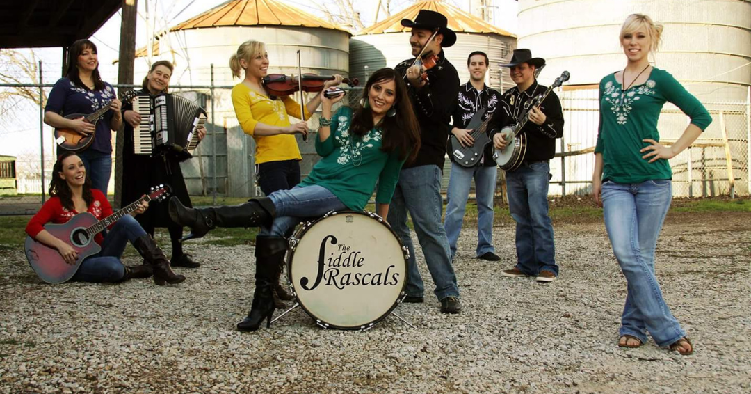 2016 Fiddle Rascals in front of silos at Lewisville Feed Mill